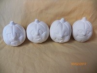 4 pumpkins with expressions