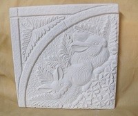 a tile with rabbits