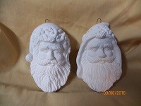 2 Santa head ornaments