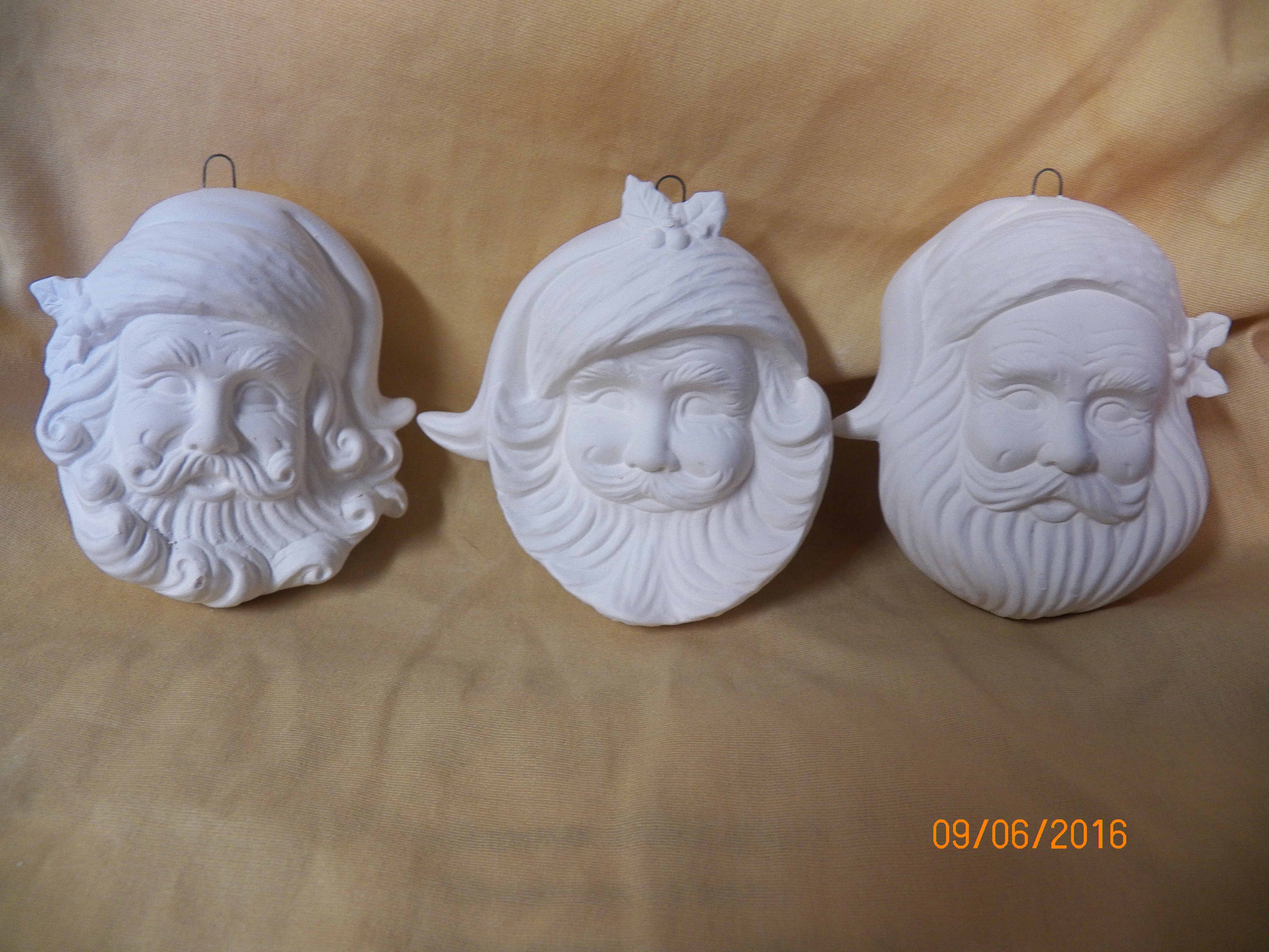 3 Santa head ornaments