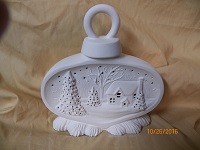 small ornament with house scene
