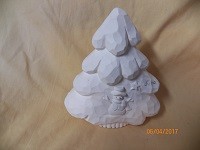 small carved tree with snowman and star