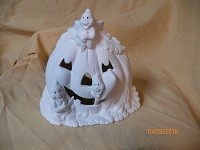 ghosts carving pumpkin