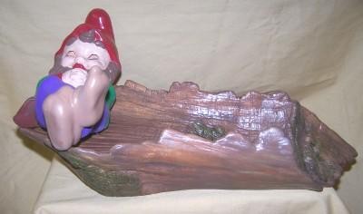 gnome asleep on log