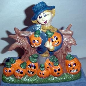 scarecrow with nine pumpkins